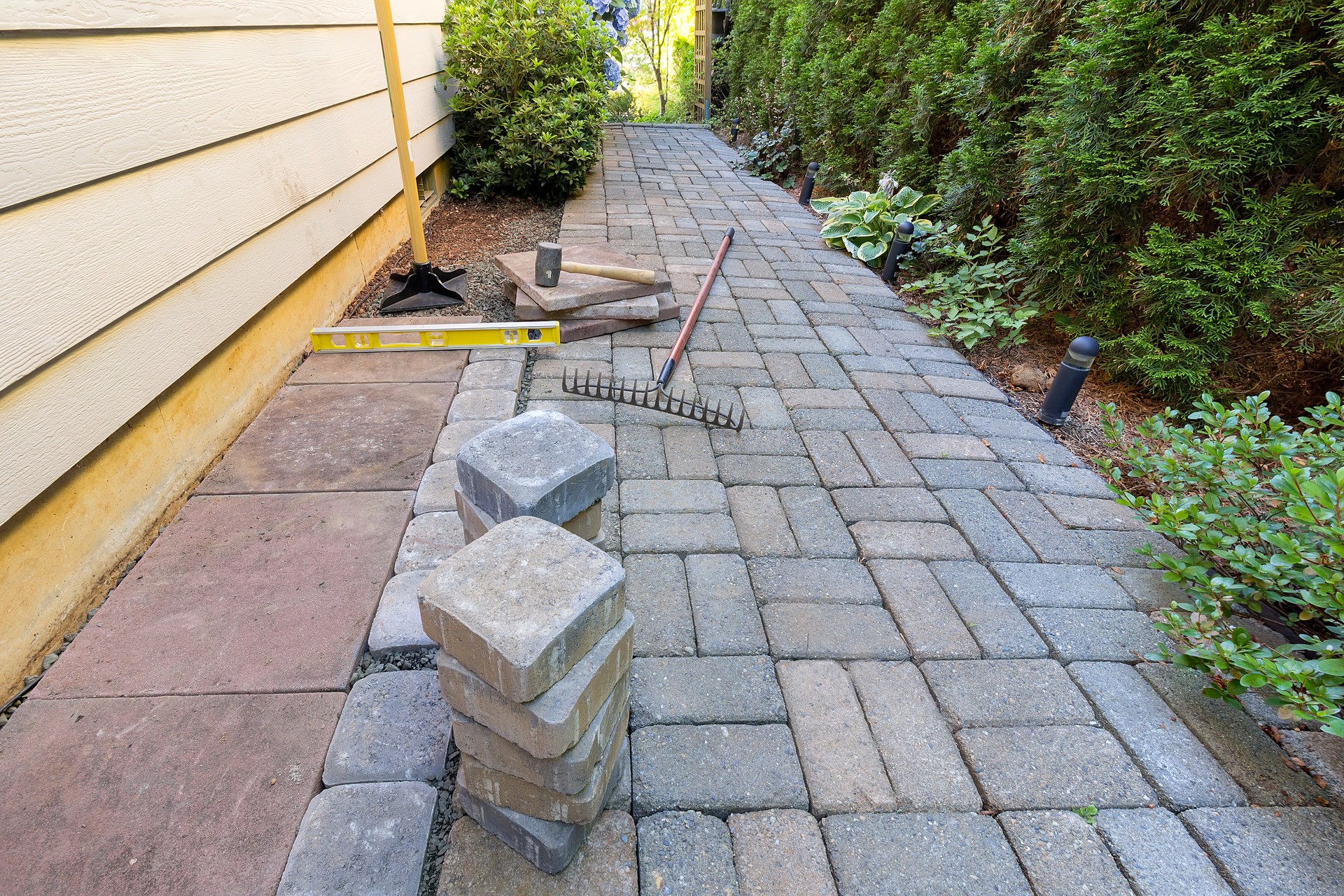 Stone Pavers and Tools for Side Yard Landscaping